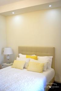 Uma cama ou camas num quarto em Alecrim Rosmaninho Guest House