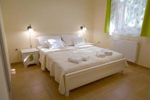 Ένα ή περισσότερα κρεβάτια σε δωμάτιο στο Balzsam apartmanház