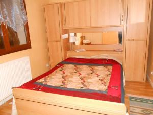 a small bedroom with a bed in a room at Villa Agapenthe in Cluny