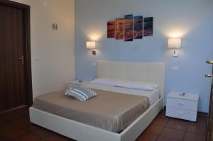 Кровать или кровати в номере Il Palombaro Rooms
