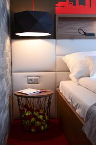 Łóżko lub łóżka w pokoju w obiekcie AGA Tenis Apartments by Radwańska