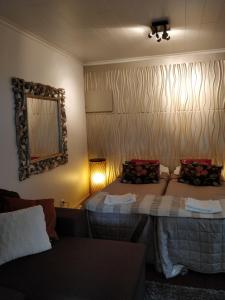 Ένα ή περισσότερα κρεβάτια σε δωμάτιο στο Majatalo & Ravintola Villa Emilia