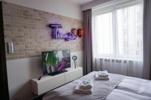 Łóżko lub łóżka w pokoju w obiekcie AGA Tenis Apartments by Radwańska
