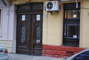 a pair of doors on the side of a building at Apartment on Pekarska street зі світлом! in Lviv