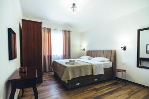 a bedroom with a bed and a wooden floor at Luxury Villa Borak in Imotski +75 photos