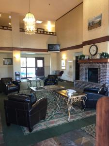 a large living room with couches and a fireplace at The Ashley Inn of Tillamook in Tillamook