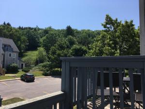 a balcony with a car parked in a parking lot at Blue Mountain Studio Loft at North Creek Resort in Blue Mountains