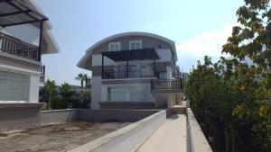 a white building with a dome on top of it at Taurus Residences 2 in Kemer