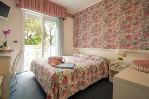 Postel nebo postele na pokoji v ubytování Hotel Astro