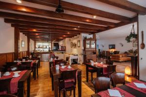 a restaurant with tables and chairs in a room at Mallorca Boutique Hotel in Malgrat de Mar