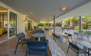 Um restaurante ou outro lugar para comer em Hotel Esperia