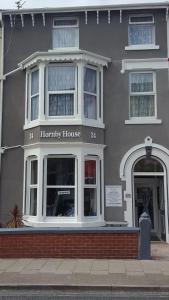 a home with a harry ransom house on a street at Hornby House Hotel in Blackpool