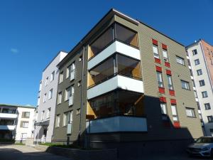 a building with balconies on the side of it at Westbay Inn in Vaasa