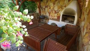 a patio with a table and chairs and a pizza oven at Agro Relax Nowodwór in Nowodwór