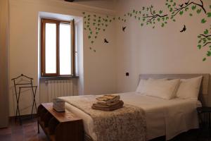 A bed or beds in a room at La Casetta Superior