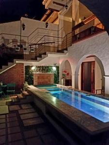a swimming pool in the middle of a house at Casa Ensueño Hogar Boutique in Guaduas