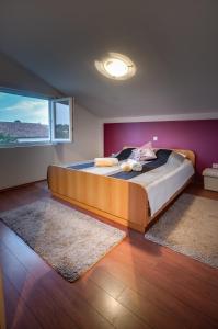 Postel nebo postele na pokoji v ubytování Apartman NANE