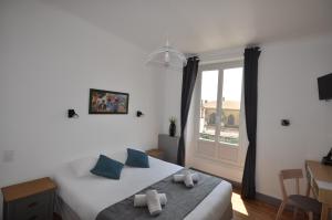 Un ou plusieurs lits dans un hébergement de l'établissement Hotel Cote Basque
