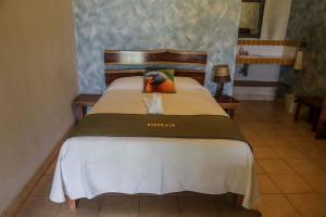 Postel nebo postele na pokoji v ubytování Hotel Bahia Taitza