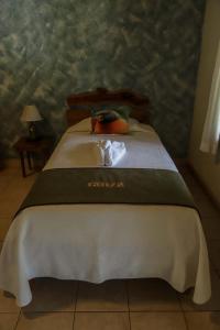 Postel nebo postele na pokoji v ubytování Hotel Bahia Taitza
