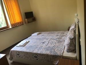 Postel nebo postele na pokoji v ubytování Sunny Paradise Family Hotel