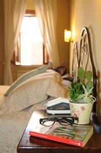 Letto o letti in una camera di Albergo Duomo