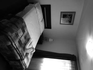 Ένα ή περισσότερα κρεβάτια σε δωμάτιο στο Hostal Samichay
