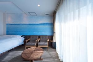 Postel nebo postele na pokoji v ubytování Enoca Hotel