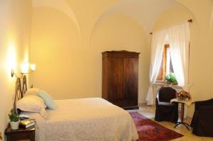 Letto o letti in una camera di Albergo Duomo