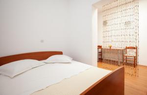 Postel nebo postele na pokoji v ubytování Apartments R