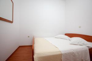 Postel nebo postele na pokoji v ubytování Apartments R