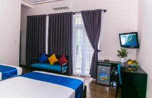 Postel nebo postele na pokoji v ubytování Blue Star Hotel