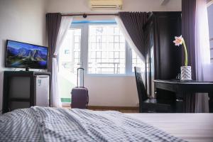Postel nebo postele na pokoji v ubytování Blue Star Hotel