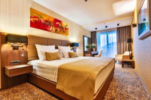 Un pat sau paturi într-o cameră la Hotel Zeta
