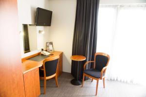 Televiisor ja/või meelelahutuskeskus majutusasutuses Best Western Plus Aldhem Hotel