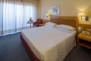 Postel nebo postele na pokoji v ubytování Best Western Hotel I Triangoli