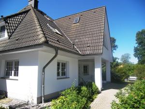 a white house with a gray roof at Ferienhaus 1A in Gothen