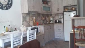 Kuchyň nebo kuchyňský kout v ubytování Violetta Rooms + 27 fotografií