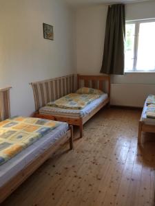 Postel nebo postele na pokoji v ubytování Fasor vendégház