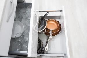 a drawer filled with pots and pans in a kitchen at Center Deluxe in Granada