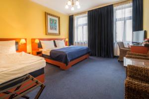 Postel nebo postele na pokoji v ubytování Hotel Arte