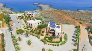 an aerial view of a house with a solarium at Nanakis Beach Apartments in Stavros