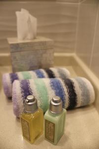 two bottles of soap sitting next to a towel at Luxury Split apartment with view in Split