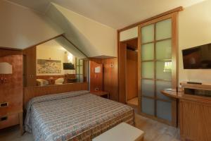 Un pat sau paturi într-o cameră la Hotel Motel Futura