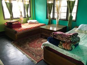 Postel nebo postele na pokoji v ubytování Vamoose Soshing Homestay