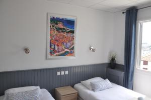 Un ou plusieurs lits dans un hébergement de l'établissement Hotel Cote Basque