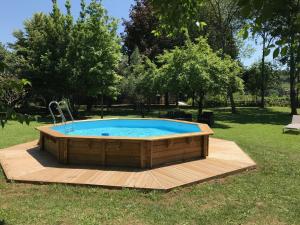 a hot tub in the middle of a yard at Mas La Mata in Olot