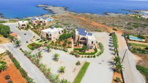 an aerial view of a house on the beach at Nanakis Beach Luxury Apartments in Stavros