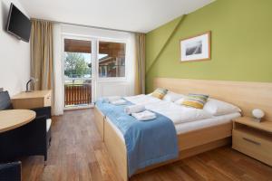 Ліжко або ліжка в номері JBX Resort Hotel Albatros