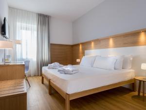 Cama o camas de una habitación en Cavallo Hotel Verona Est